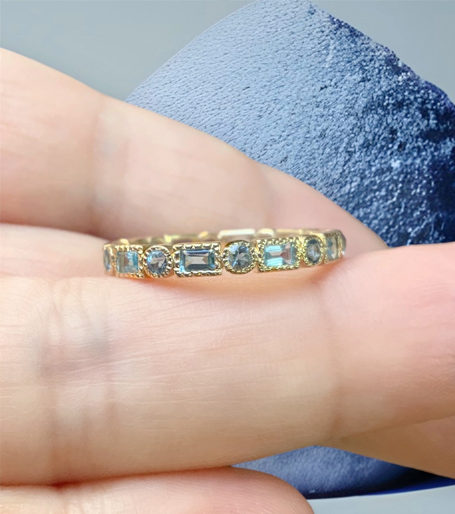 Aquamarine eternity deals band yellow gold